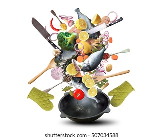 Large Iron Skillet With Falling Vegetables And Fish