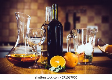 Large Jar Of Sangria With Red Wine, Oranges And Ice For Home Party, Home Kitchen Interior. Homemade Food And Drinks