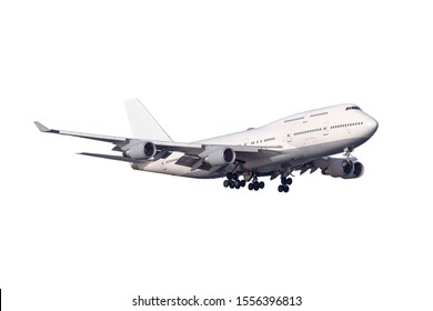 A large jumbo size airplane with four engines on the wings and landing gear with many wheels  and window isolated on white