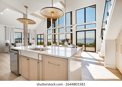 Large kitchen dining room interior white marble countertops brass light fixtures modern oven and stainless steel appliance ocean view floor to ceiling windows hardwood floor modern spacious design