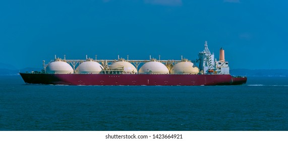 A Large Liquid Natural Gas Tanker Ship In The Singapore Straits In Asia In Summertime