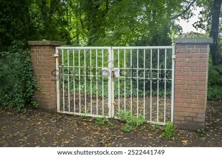 large locked old garden gate