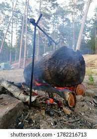 A large log is burning in a fire, close-up