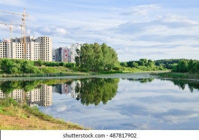 Large Long (Vynohradiv) a pond in North Moscow. Summer landscape. A view of the construction of new residential apartment buildings - Shutterstock ID 487817902