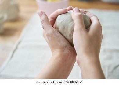 Large Lump Of Clay In Female Hands