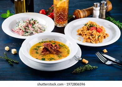 Large Lunch Set Of Three Courses Soup, Second Course And Salad, Top View Of A Three Course Set Menu Served On Wooden Table, Business Lunch Set Made Of Three Meals