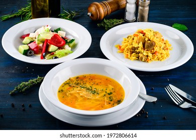 Large Lunch Set Of Three Courses Soup, Second Course And Salad, Top View Of A Three Course Set Menu Served On Wooden Table, Business Lunch Set Made Of Three Meals