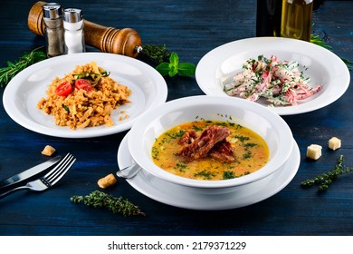 Large Lunch Set Of Three Courses Soup, Second Course And Salad, Top View Of A Three Course Set Menu Served On Wooden Table, Business Lunch Set Made Of Three Meals