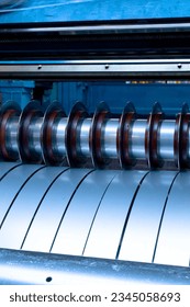 Large machines are using steel plate slitting blades to divide the size of large steel coils.