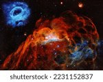 Large Magellanic Cloud in the Milky way showing a giant red nebula and a smaller blue nebula. Digitally enhanced. Elements of this image furnished by NASA.
