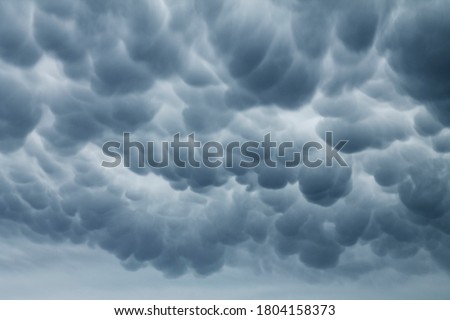 Large Mammatus clouds in the sky after a storm in North Texas