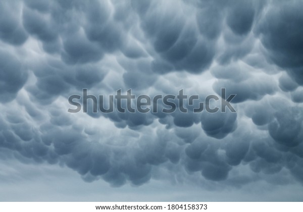 Large Mammatus clouds in the sky after a storm in\
North Texas