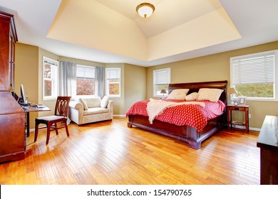 Large Master Bedroom Interiors With Vaulted Ceiling And Hardwood Floors.