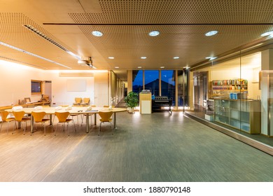 Large Meeting Room In Wood Office Building With Acoustic Ceiling And Sliding Glass Partition Walls