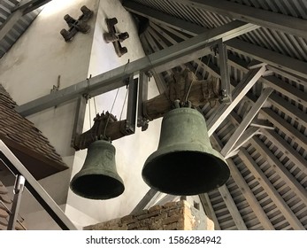 Large metal bells within a wooden roof of a tower in Split, Croatia