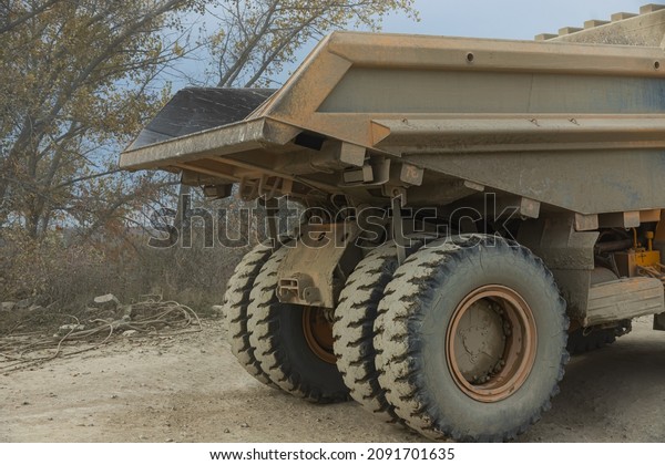 Large mining dump truck. Transport industry.\
Extraction of stone in an open\
pit.