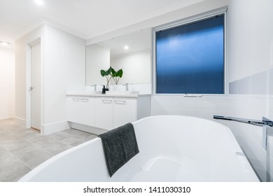 Large Modern Bathroom Interior With High End Fittings And Stand Alone Bathtub. PERTH, AUSTRALIA. MAY 2019.