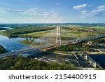 Large modern bridge over river in europe city with car traffic, aerial view. Redzinski bridge over Oder in Wroclaw, Poland