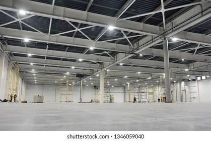 Large modern empty storehouse. Warehous building construction. Industrial warehouse interior.