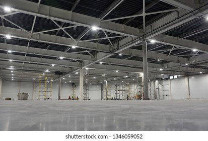 Large Modern Empty Storehouse. Warehous Building Construction. Industrial Warehouse Interior.