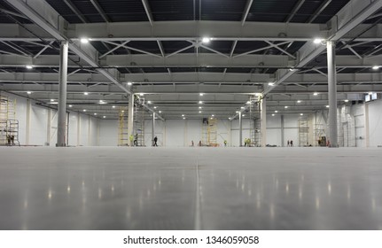 Large modern empty storehouse. Warehous building construction. Industrial warehouse interior.
