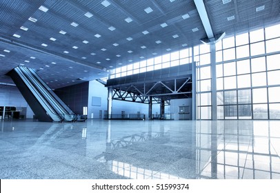 Large modern hall with windows and escalator