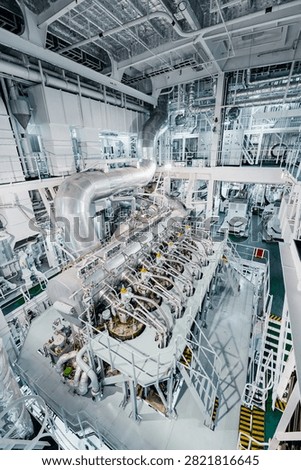 Large Modern Ship Engine Room with Main Diesel Propulsion System and Piping
