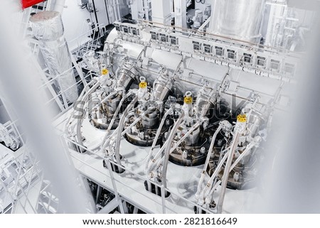 Large Modern Ship Engine Room with Main Diesel Propulsion System and Piping