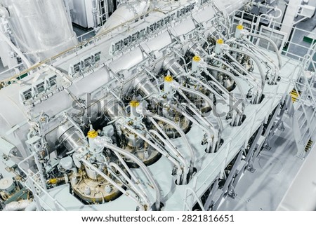 Large Modern Ship Engine Room with Main Diesel Propulsion System and Piping