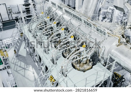 Large Modern Ship Engine Room with Main Diesel Propulsion System and Piping