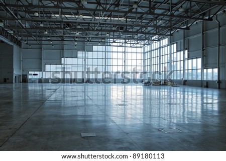 Large modern storehouse with window at wall