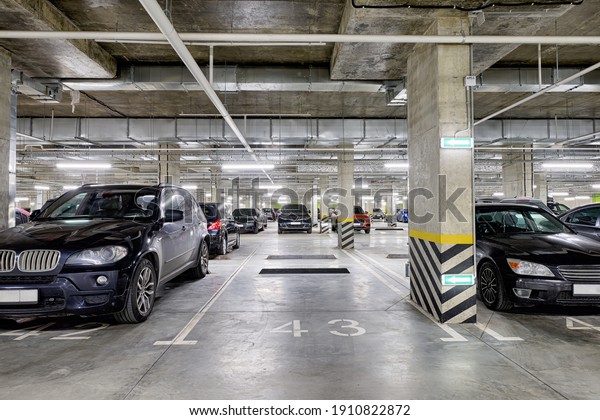 Large modern underground parking for cars. New\
underground car parking,\
garage