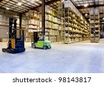 Large modern warehouse with forklifts