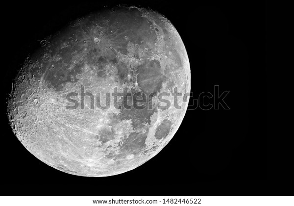 Large moon with\
creators shot through\
telescope