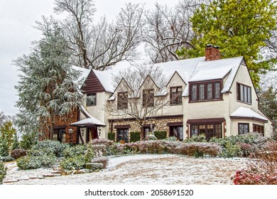 Large Multi-gabled House On Hill Surrounded By Trees In Snow On Overcast Day