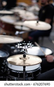 A Large Musical Plate With A Set Of Small Ones In A Drum Set. 