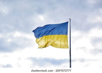 Large national flag Ukraine flies in the blue sky  Big yellow blue Ukrainian state banner in the Kharkiv city  Independence  flag  Constitution Day  National Holiday  text space 