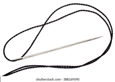 A Large Needle With A Black Thread Kapron Isolated On White Background