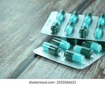 A large number of pill blister packs on a brown background. - Powered by Shutterstock