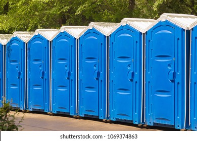 A large number of street toilets in the city park.