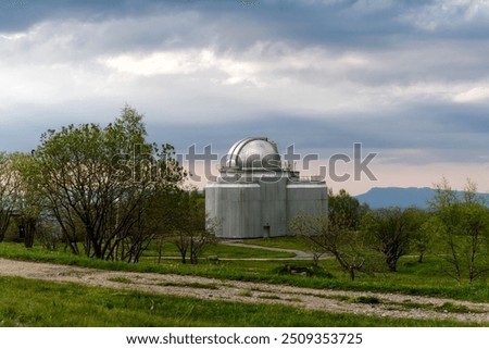 Large observatory dome with cloudy sky in the background Special astrophysical observatory of the Russian academy of sciences, Arkhyz