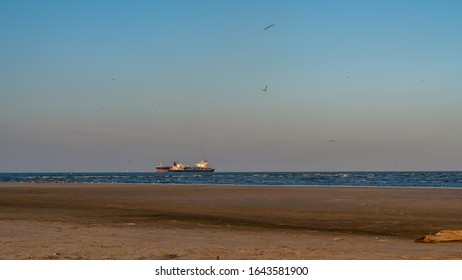 A Large Ocean Liner On The Coast Of Galveston Seawall.