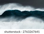 Large ocean wave breaking during heavy swell just after a storm at sunrise, Bronte Beach, Sydney, Australia.