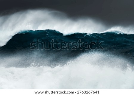 Large ocean wave breaking during heavy swell just after a storm at sunrise, Bronte Beach, Sydney, Australia.