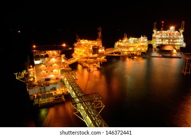 The Large Offshore Oil Rig At Night In Gulf Of Thailand