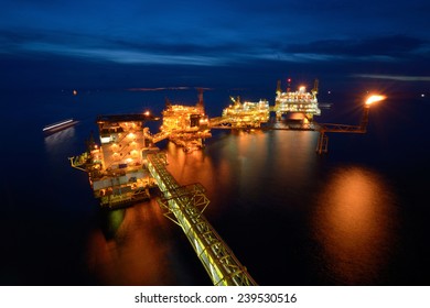 The Large Offshore Oil Rig Platform At Night In The Gulf Of Thailand