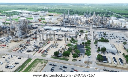 Large oil refinery complex with crude oil distillation unit, storage tanks, utility systems, pipelines in agriculture agro-town San Antonio, Texas, produce gasoline, diesel, benzene, LPGs, aerial. USA
