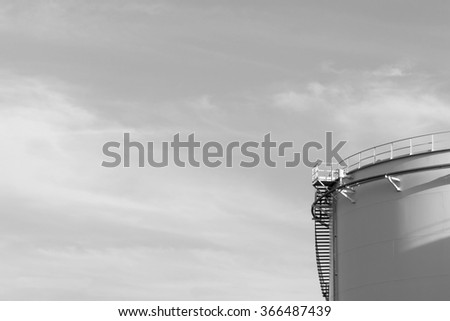 Large oil tank black and white .