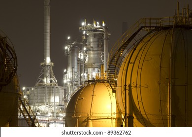 A large oil-refinery plant with gas storage tanks