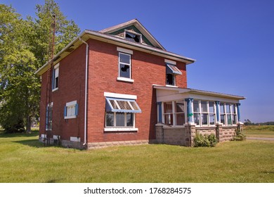 A Large Old Abandoned Brick House With A Stone Addition And Major Foundation Issues.